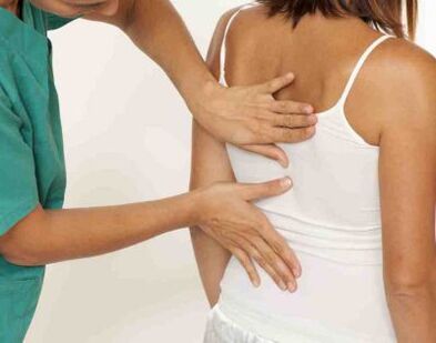 A patient complaining of pain in the shoulder blades on both sides at the doctor's appointment